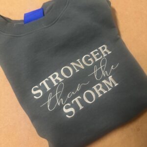 Stronger Than The Storm – Embroidered Sweater
