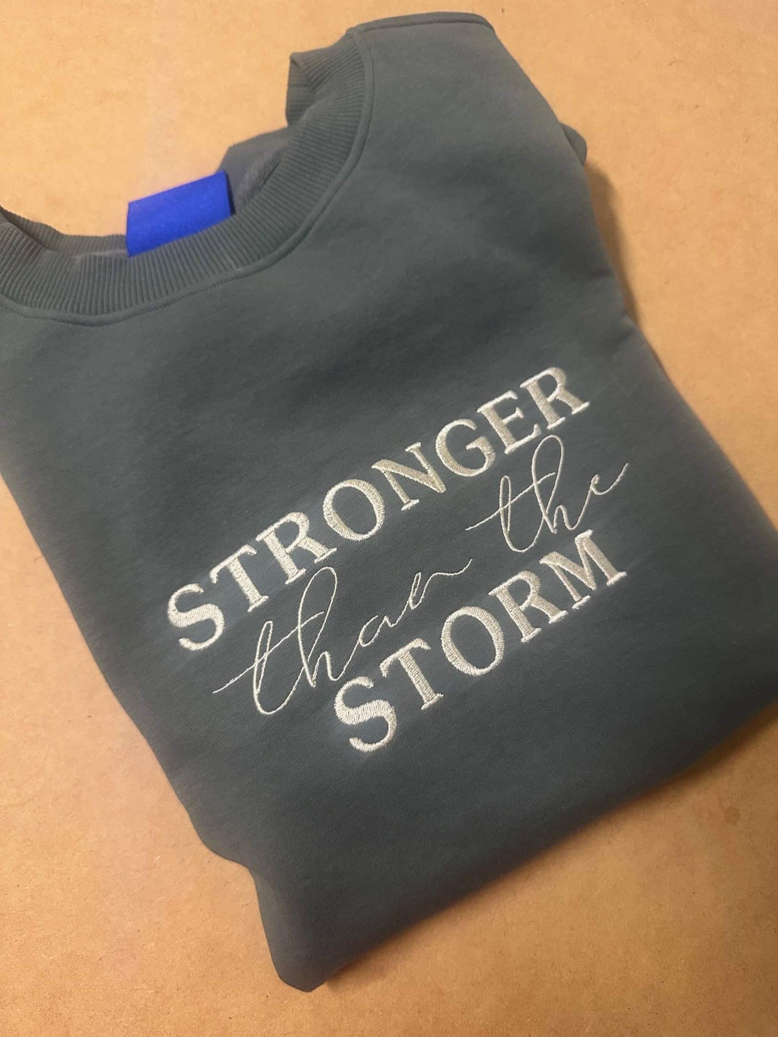 Stronger Than The Storm – Embroidered Sweater